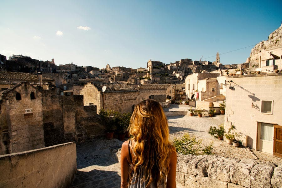 Girl looking at beautiful Italian town