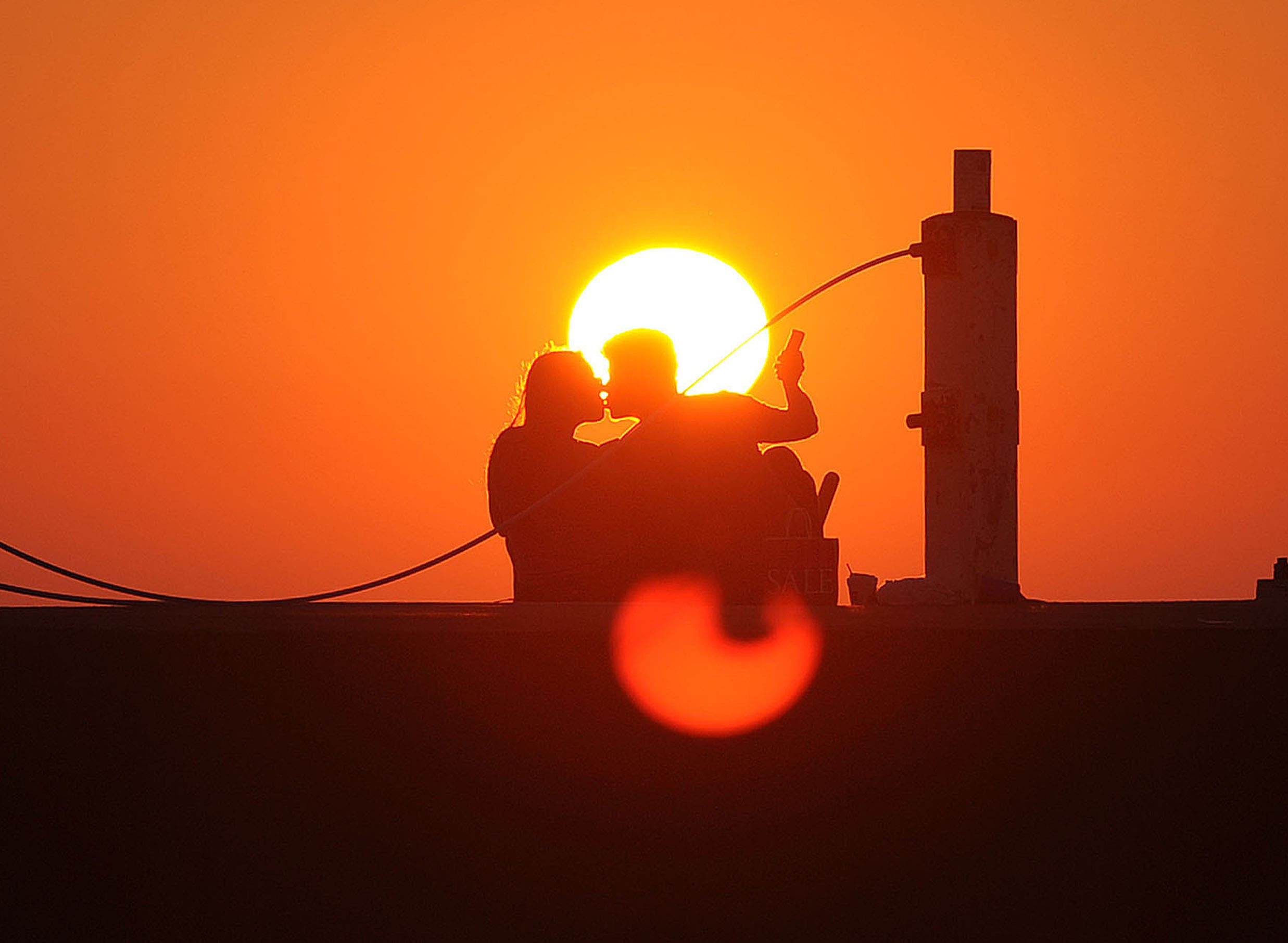 Selfie, lovers at sunrise © Photography from personal collection of John H. White, Pulitzer Prize Photographer