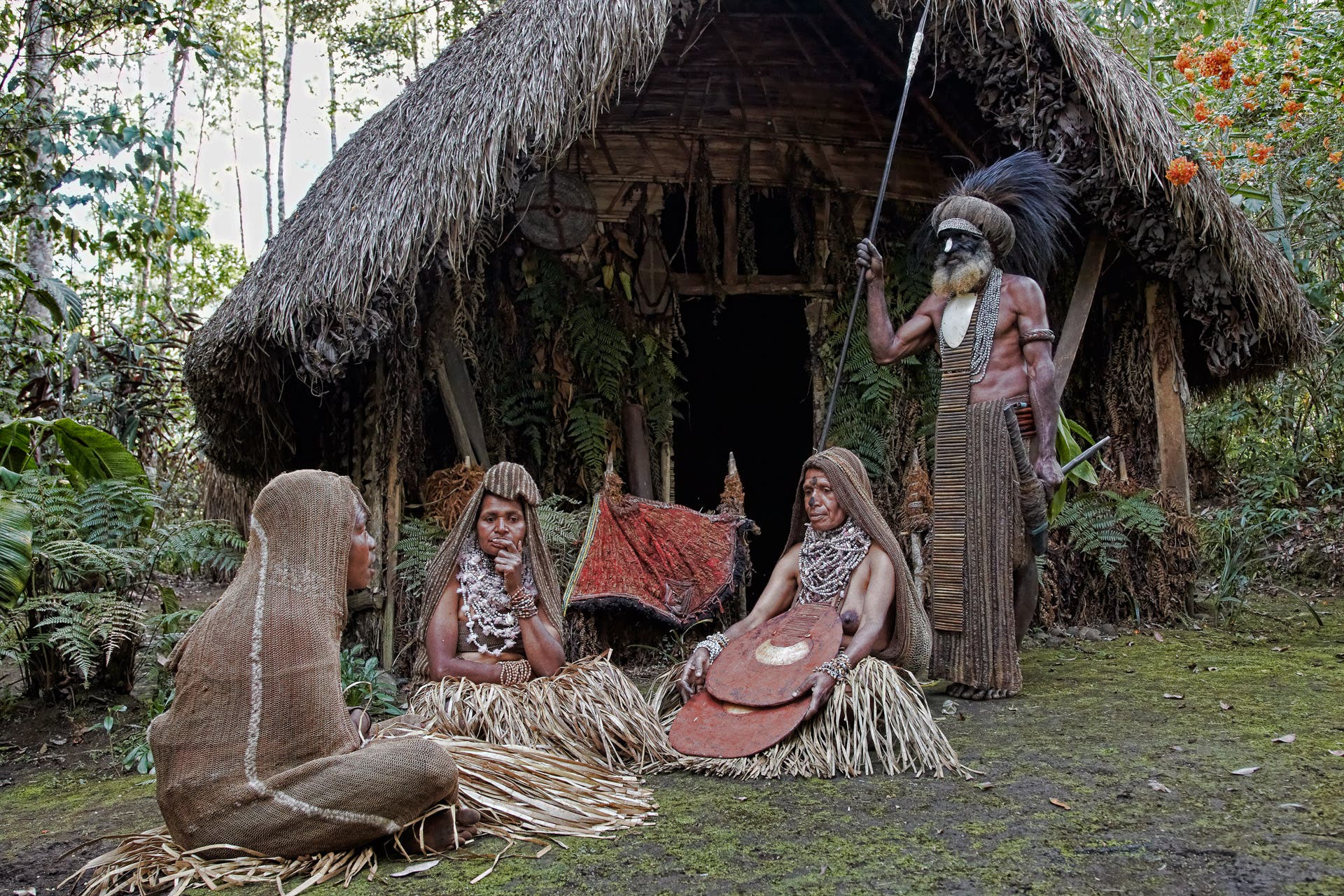 The friendly chief of Paiya village with his three wives.