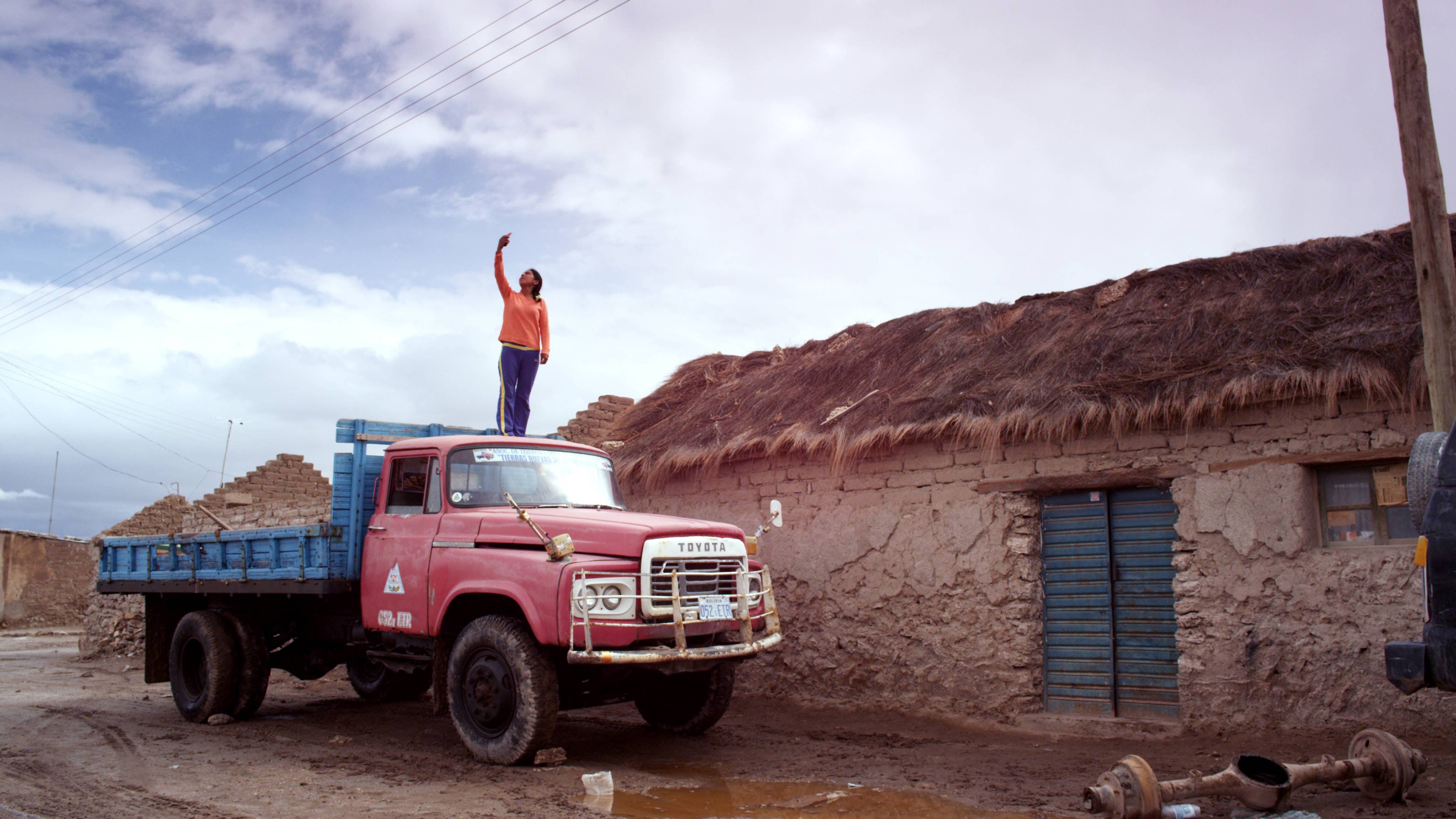 A scene from Salero: Nelvi Chambi searches for a cell signal at home in Colchani.
Courtesy of Cinereach. © Salero Film LLC. All rights reserved.