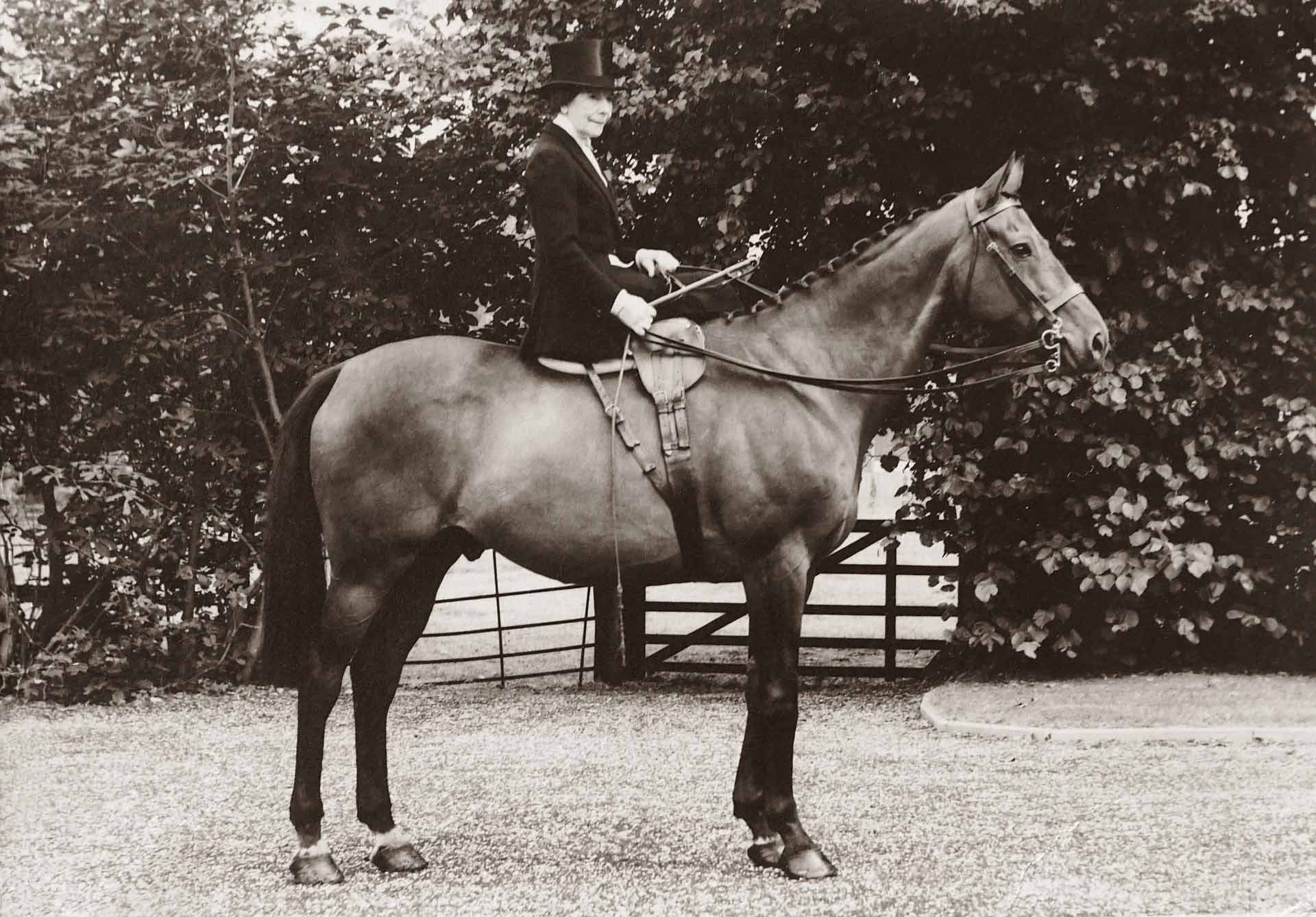 old photo of a woman riding a horse
