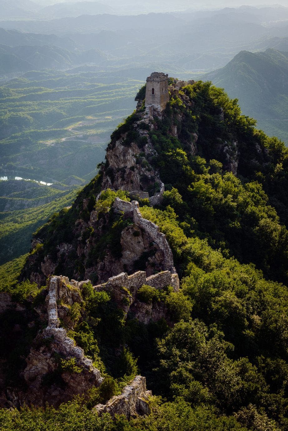 The Great Wall of China. I was fortunate to have a spare day following a commercial shoot I had just completed in Beijing, so I organised to visit a remote area of the Great Wall called “Wang Jing Lou”. To access this section we drove around 3 hours from Beijing to a local village somewhere between Simitai and Jinshanling, from where we were escorted to the wall (another two or three hours walking and then steep climbing and rock scrambling) by a friendly local with no English. The experience of getting there was almost as amazing as being there! As luck would have it the skies were clear - the usual dense “smog” that hides China’s natural beauty was nowhere to be seen - and we purportedly had the clearest sunset they’d seen since the Beijing Olympics (when the sky was artificially “seeded” to force rain which would clear the atmosphere). A perfect example of why being a travel photographer always works better when you put in the effort to be there, I find that “luck” often goes my way… when I make sure to go looking for it that is!!