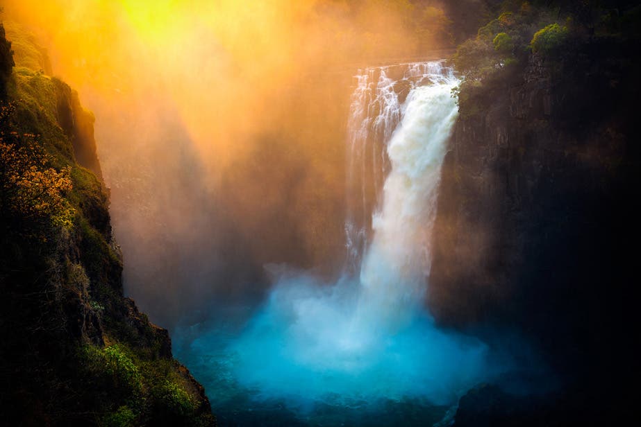 A glimpse of the mighty Victoria Falls cascading into the River Zambezi, taken from the Zimbabwe side of the border (the river divides Zimbabwe and Zambia). There are a number of natural icons around the world that are recognisable to all, no matter where you are from or how much you have – or have not – travelled. Mt Everest in Nepal, Ayers Rock in Australia, Great Britain’s White Cliffs of Dover, Table Mountain in South Africa and the Grand Canyon in the US to name only a few. Victoria Falls are the largest waterfall in the world (based on combined width and height) and was certainly a “must” for me to photograph when I had a few days off prior to guiding a Photo Tour group through nearby Botswana.