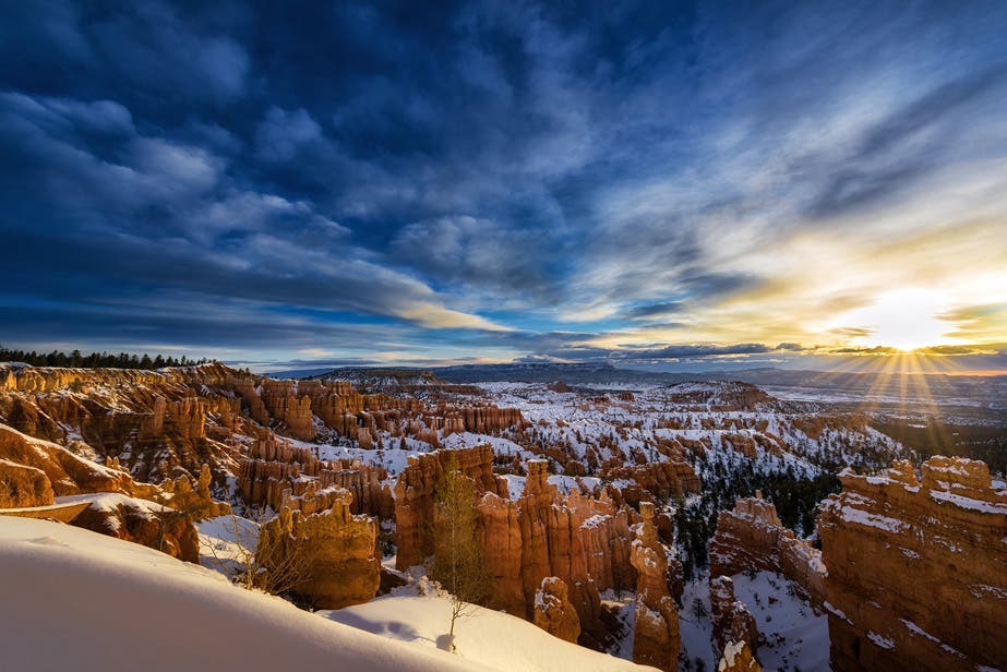 Last year my wife joined me in the US following a commercial shoot I had in Avon, Colorado. We hired a vehicle and hit the road, driving through Colorado and into Utah and visiting many of the National Parks along the way. With a snow storm pending we decided we needed to get to Bryce Canyon, an incredible landscape featuring red cliff walls and standing rock spires or “hoodoos” that look stunning when covered in snow. We chose not to take the main route and instead journeyed the scenic highway from Moab, via Hanksville, the Boulder Pass and Escalante. We drove through the snow, knowing the results would be worth it when we arrived. And sure enough, we reached Bryce Canyon amid heavily falling snow and woke up the next morning to a surreal, snow covered landscape with stormy skies that cleared to a bluebird day - fantastic conditions for a travel photographer. And of course it was all gone by the following morning.