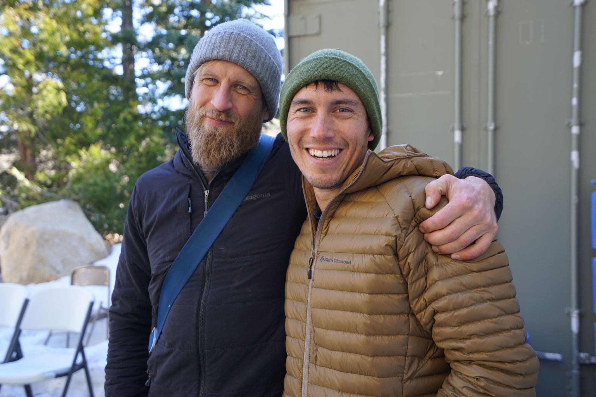Photographers Ben Moon and Chris Burkard hang out outside the main tent of Yeah Field Trip. © Liz Daza