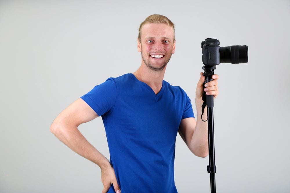 photographer with a camera monopod