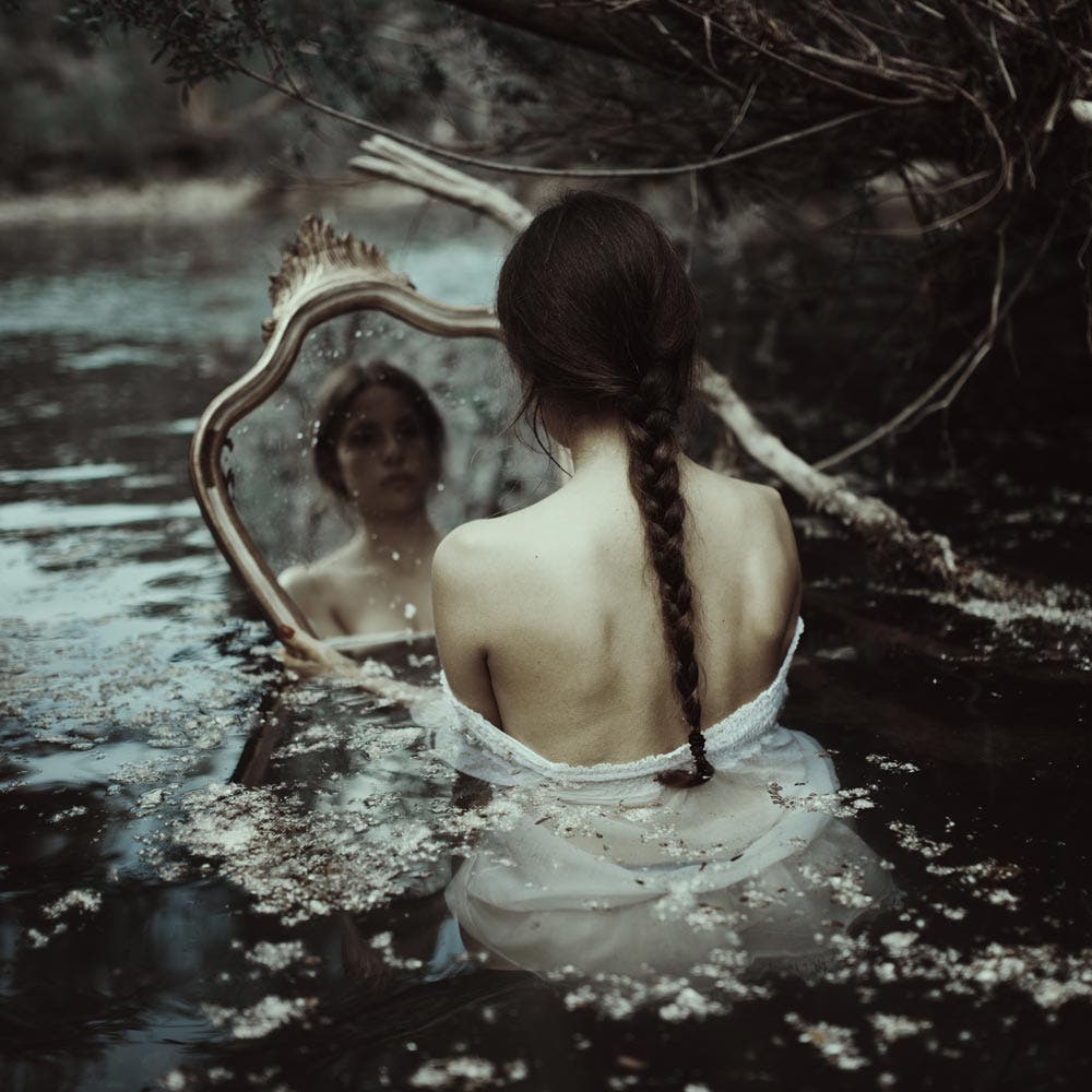 feminine beauty reflects on mirror