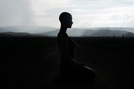 bald model meditating