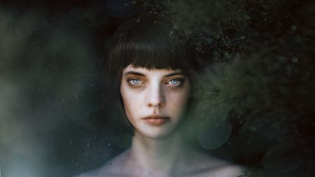 portrait of model with leaves bokeh