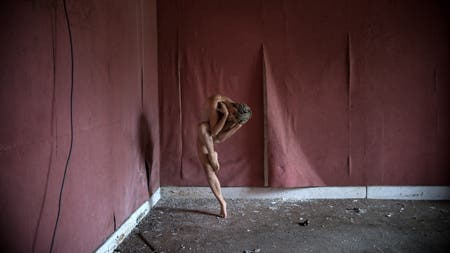 model in contortionist pose