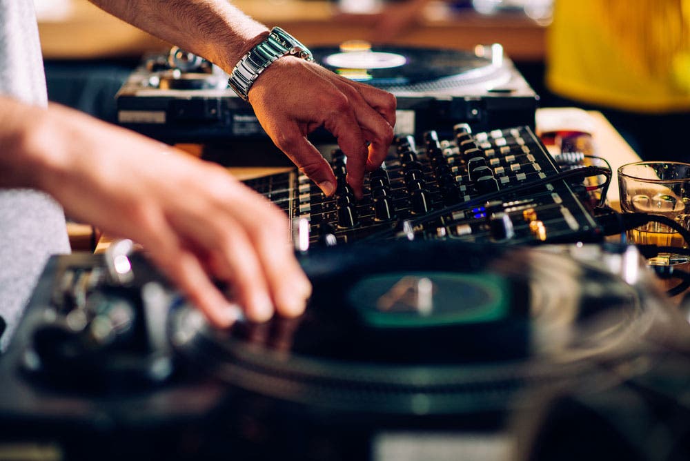professional DJ setup with turntables and mixer