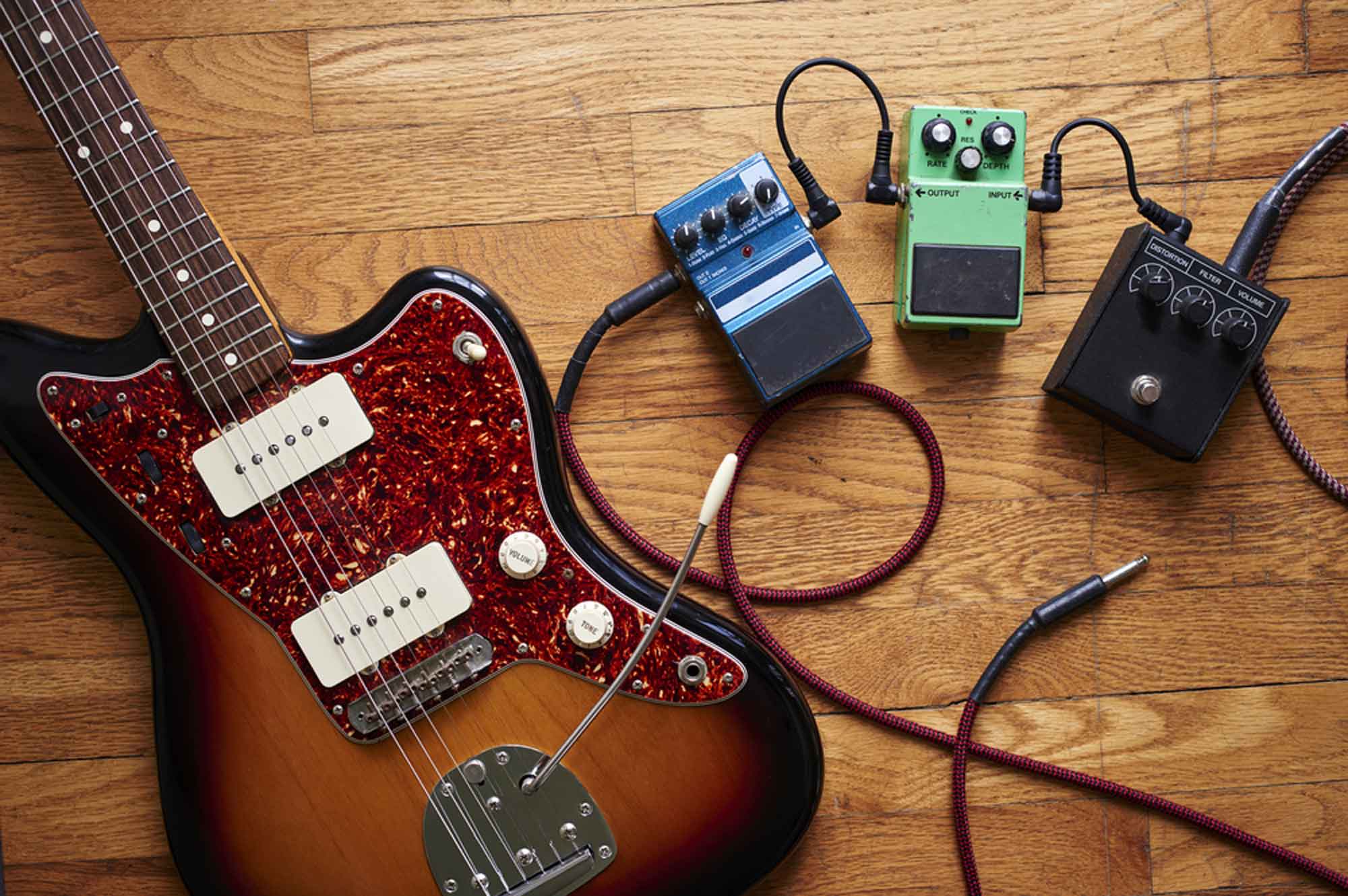 Guitar and Effects Pedals On The Floor