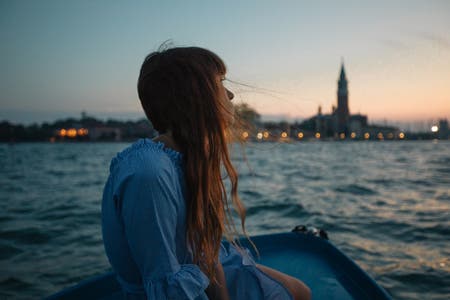 portrait of female sitting by the river travel photography
