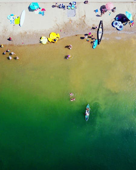 people enjoying the beach drone photography
