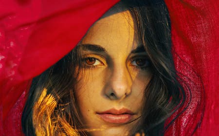 portrait of female model with red hood