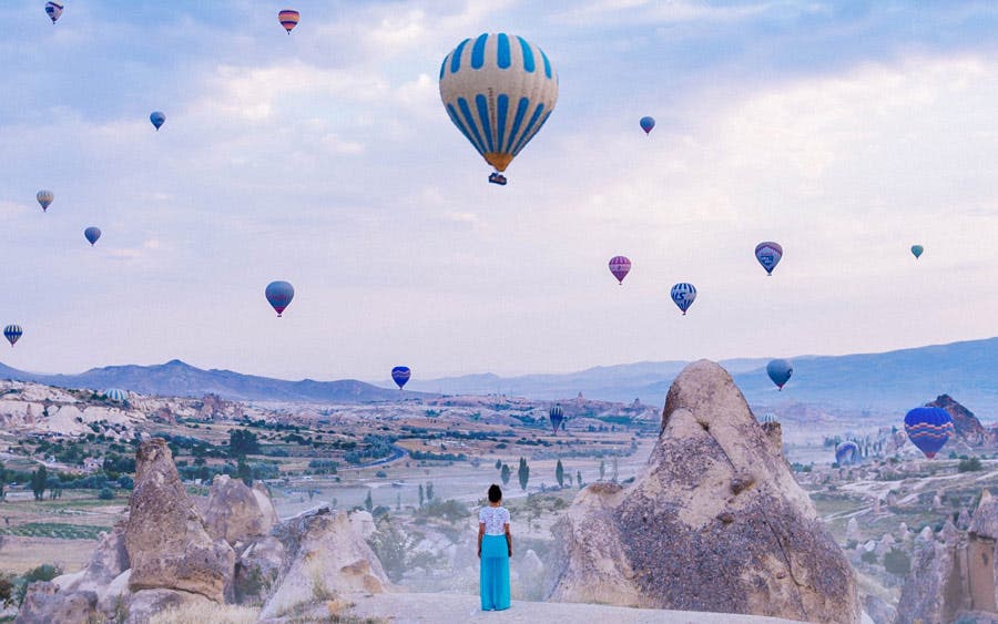 model watching hot air balloons in cappadocia travel photography