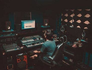 man mixing in his growing home recording studio setup