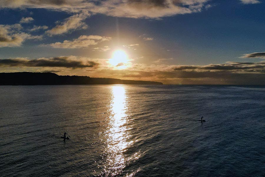 Kayakers at sunset