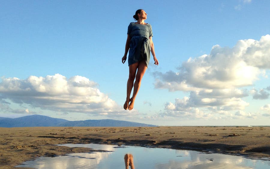 levitating woman in tuscany travel photography