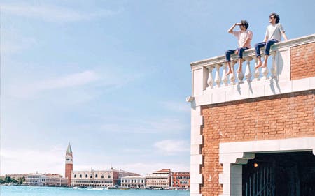 male twins sitting on terrace in venice travel photography
