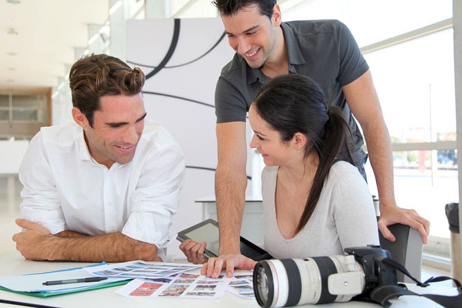 Videographers planning the storyboard for a music video production