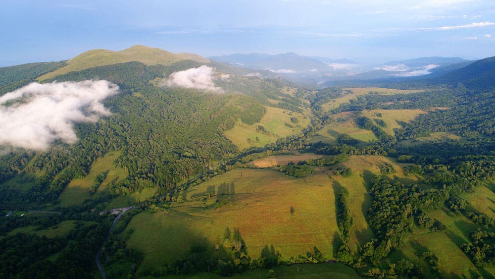 drone aerial photography of green hills and mountains