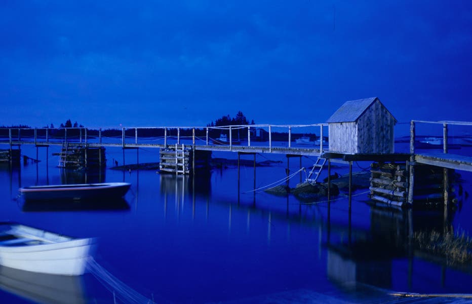 house and boat in the night