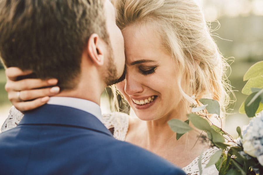 emotional pictures bride crying while dancing with groom portrait photography