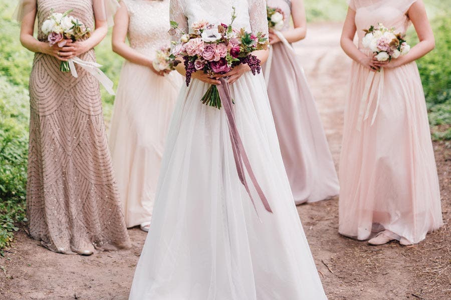 Faceless portrait of bride and her bridesmaids