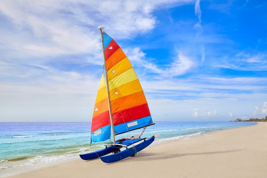 Color sailboat by the shore