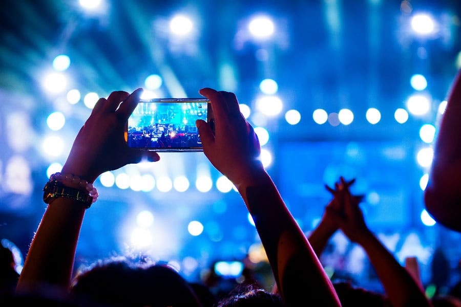Concert goer using iPhone X
