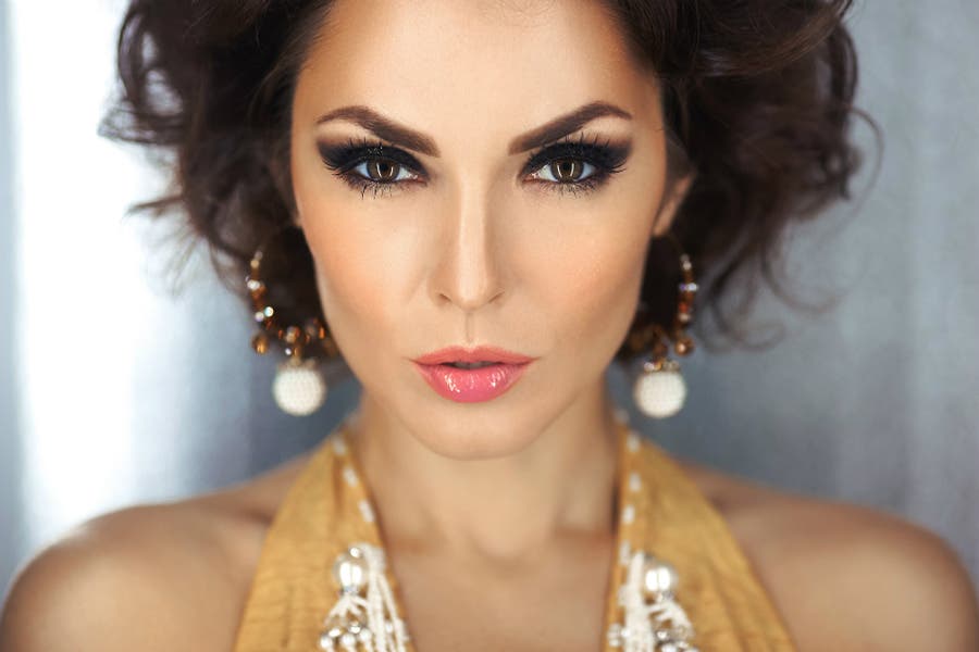 Close up portrait of woman with iPhone X studio lighting