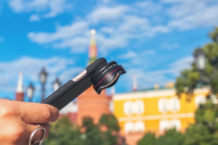an accessory lens attached to an iPhone case