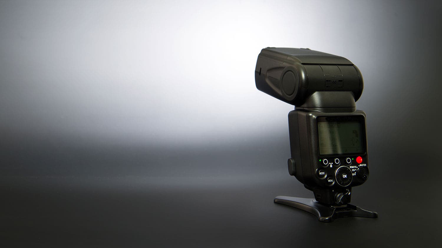 flash unit on black background in studio