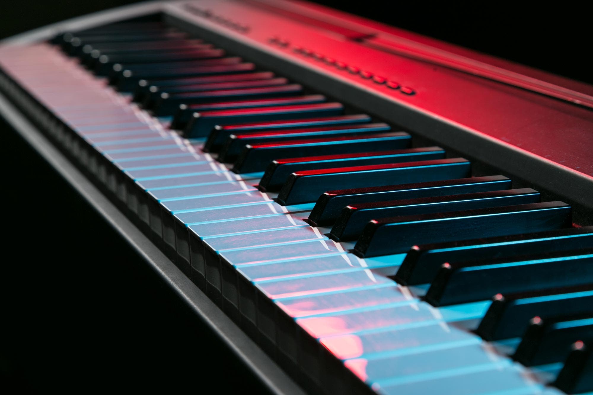 digital piano under blue and red mood lights
