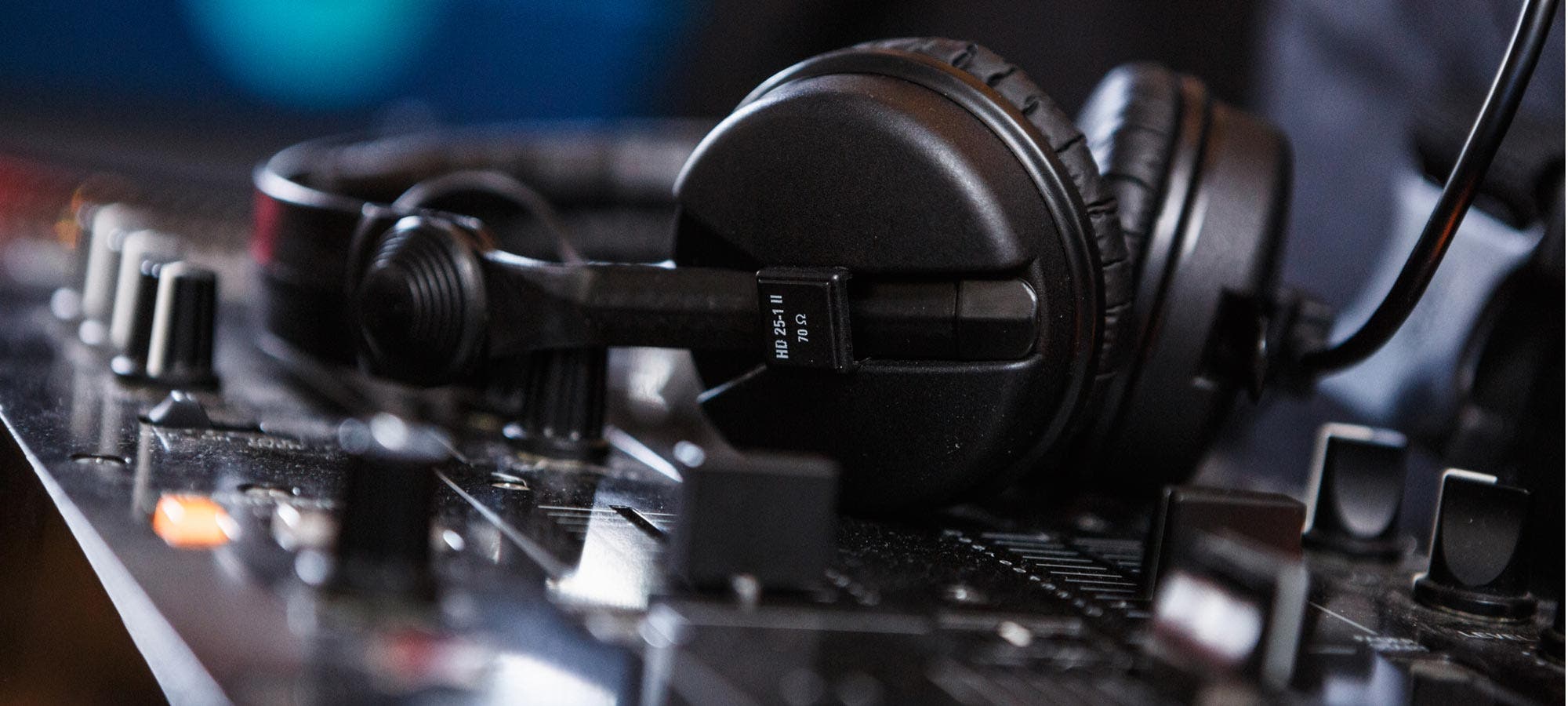 Black Sennheiser DJ headphones on mixer