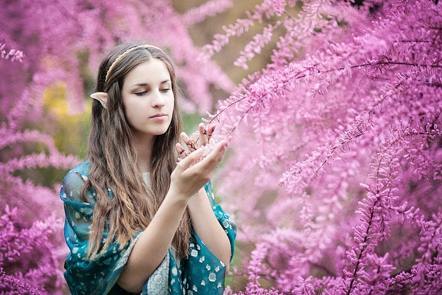 Cosplayer portraying mystic elf woman