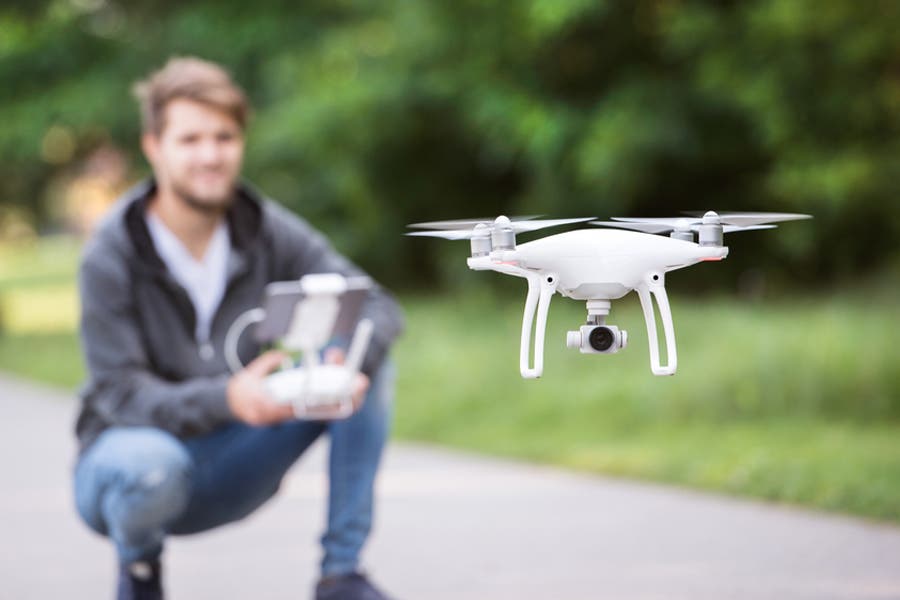 Man operating drone at eye level