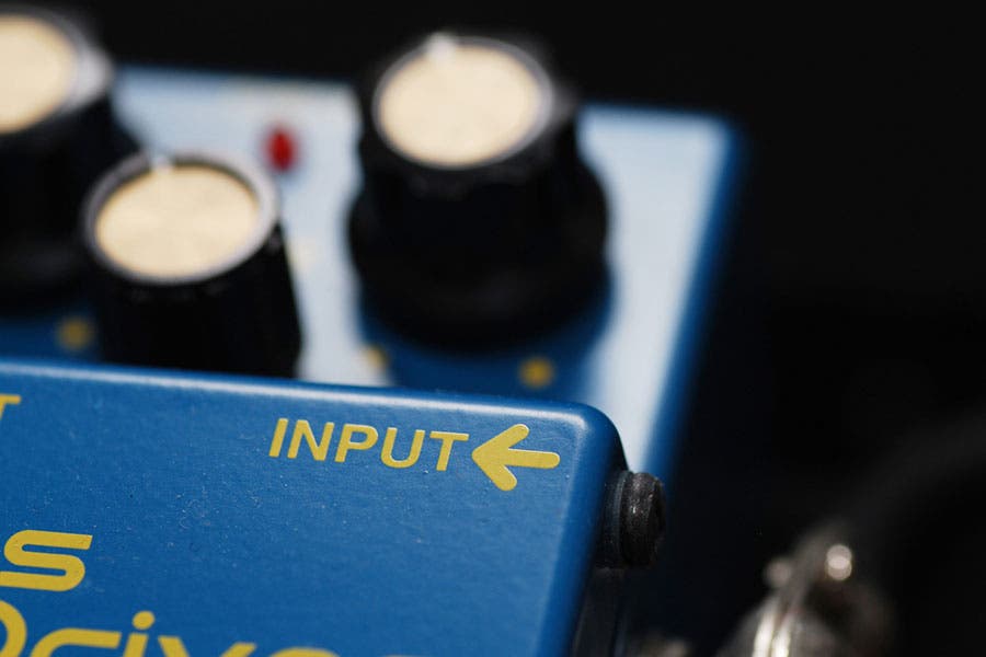 ”Boss Blues Driver overdrive pedal close up with input in focus