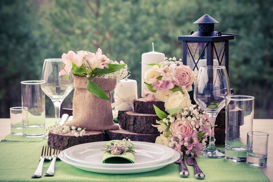 vintage-inspired photo of table setting at garden wedding reception