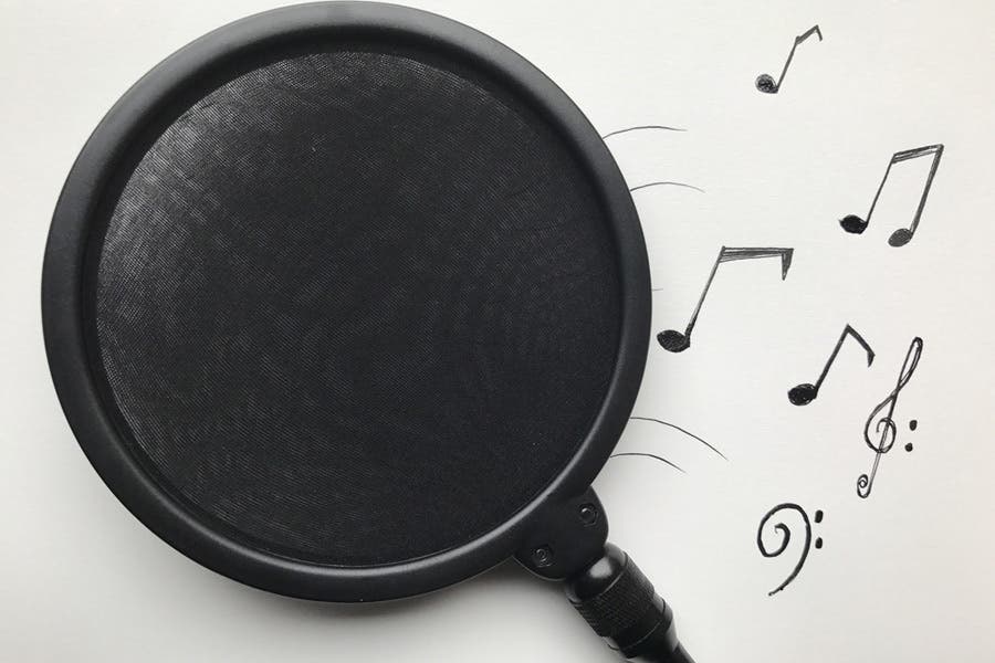 pop filter on white background with musical notes