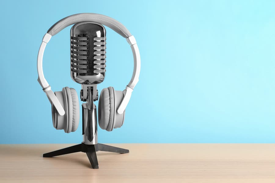 headphone and microphone on wooden desk