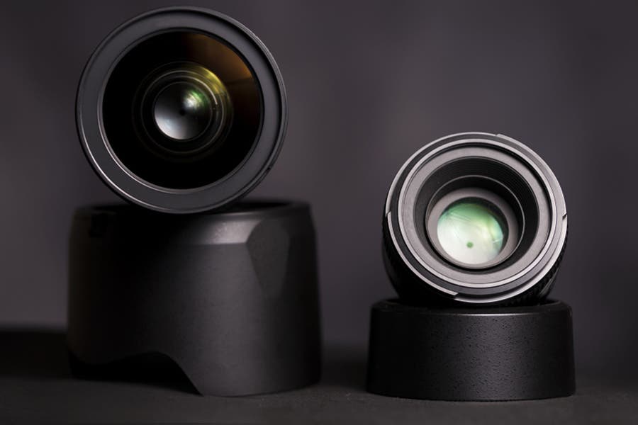 two prime lenses propped up on lens filters