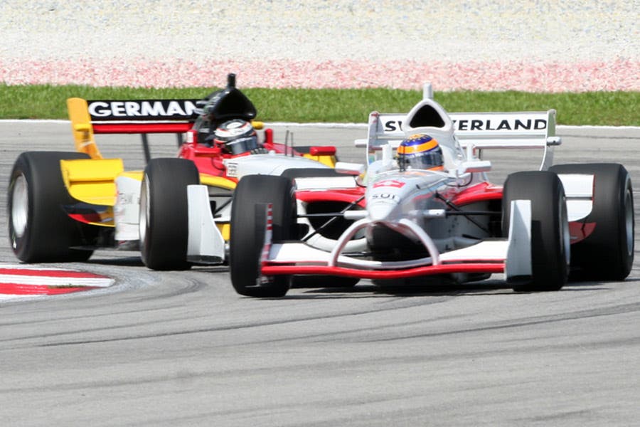 two formula one cars on the race track