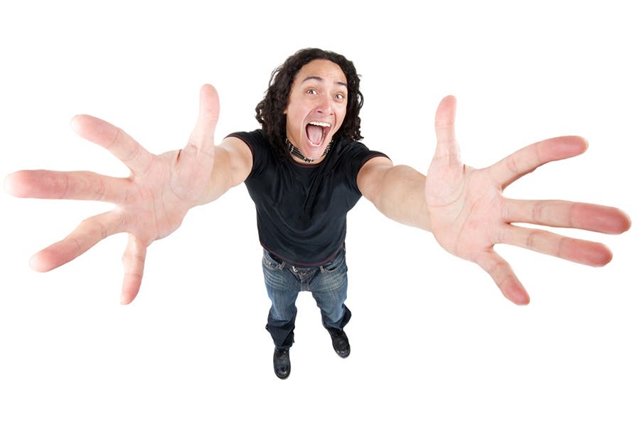 wide angle shot of man reaching out to camera