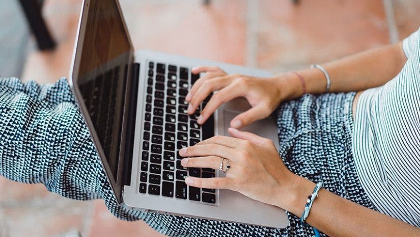 woman working on apple macbook pro 13 laptop