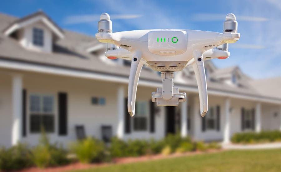 drone in focus while shooting real estate