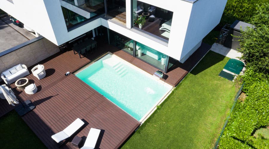 aerial view of a pool in a backyard of a modern home