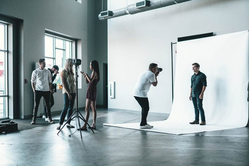 photographer with portrait camera and studio headshots