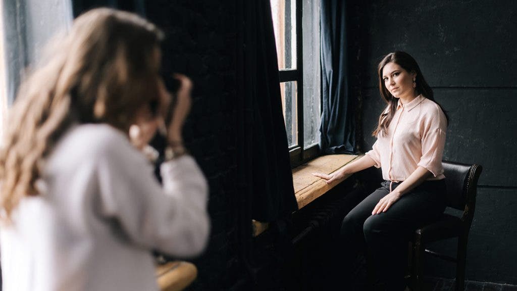 portrait photographer with camera
